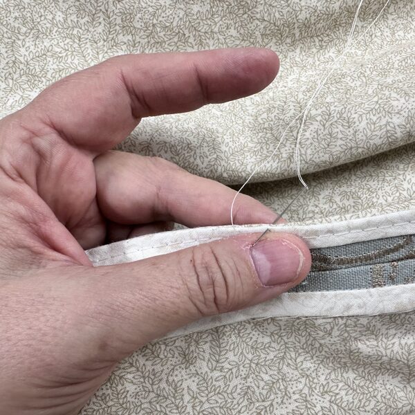 All seams are pressed open and hand sewn to the underlining